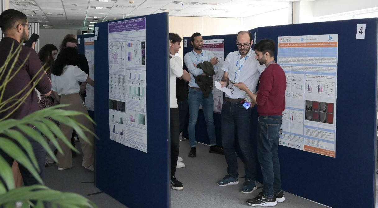 picture of scientists looking at poster boards