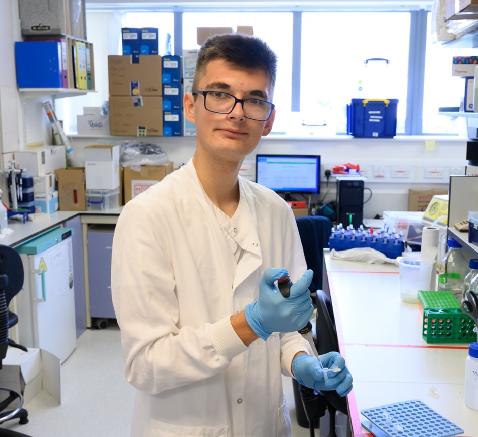 young man in a lab coat