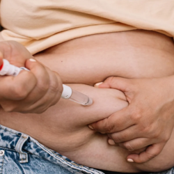 photo of a person injecting their abdomen